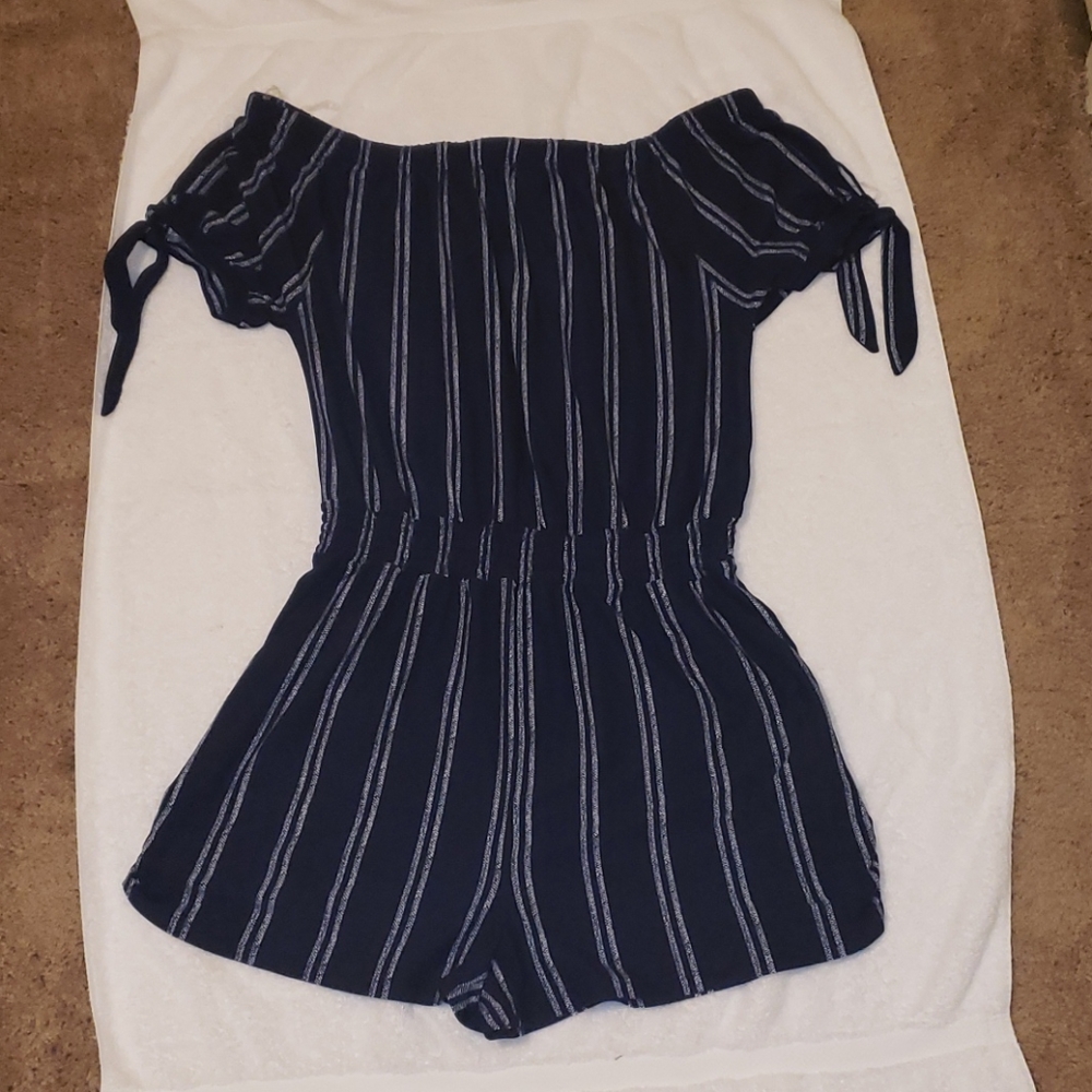 Two off the shoulder rompers.